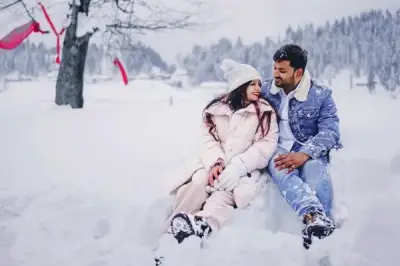 man and women enjoying snowfall